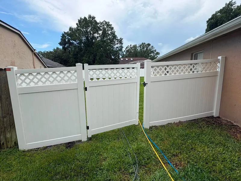 Same vinyl fence and gate gleaming white after washing