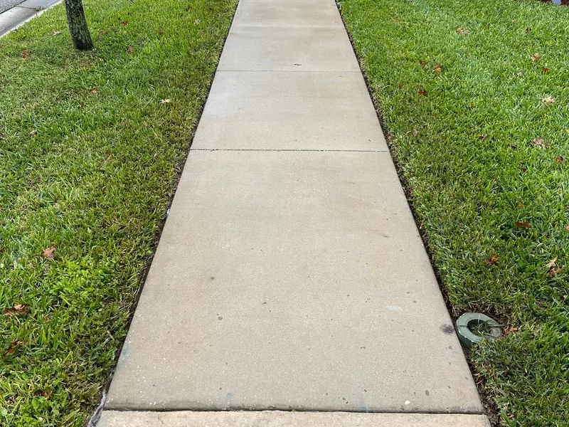 Same front walkway uniformly clean and bright after pressure washing