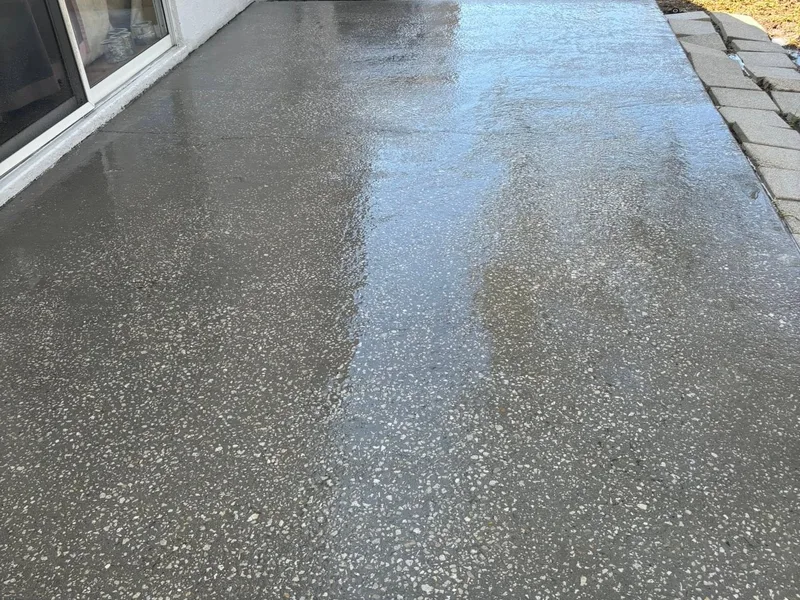 Same patio freshly washed with clean, bright concrete