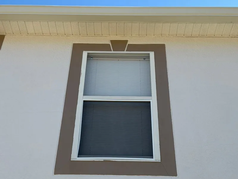 Same window, trim and soffit clean and bright after soft washing