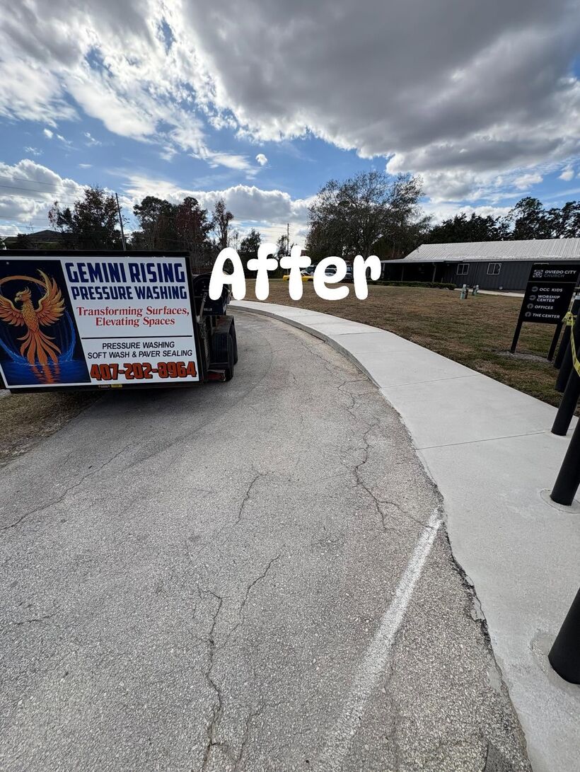 Bright white sidewalk beside the Gemini Rising branded trailer at Oviedo City Church after pressure washing
